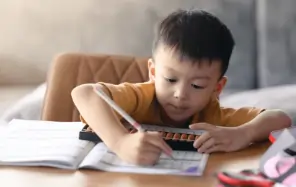 Child learning Abacus online with expert guidance, improving mental math skills and accuracy in calculations.
