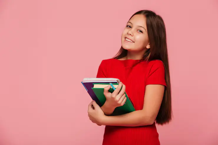 Smiling Schoolgirl Holding Books